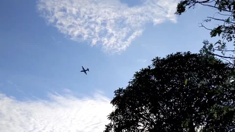 An aeroplane up high on the sky Stock Footage 147597027