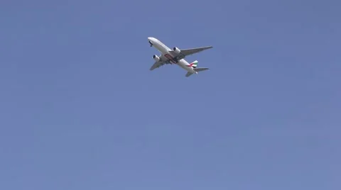 Aeroplane passing under the sun. Stock Footage 54399372