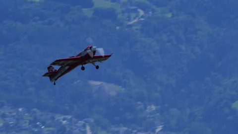 Aeroplane Sukhoi Su-26 Dive Valley Pass Pull Up Tracking Shot Stock Footage 333493586