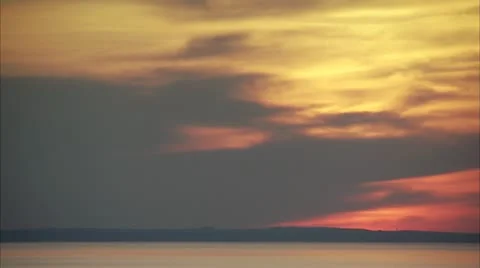 An aeroplane in the sunset over the ocean Stock Footage 11287525