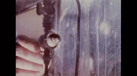 Aerosol spray being released into the test chamber Stock Footage