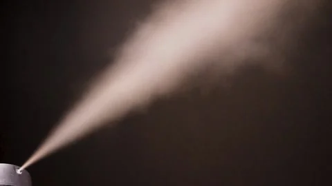 Aerosol spray on black background Stock Footage 146851762
