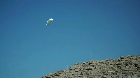 Aerostat in the sky observes the environment. UAE Stock Footage 89735061