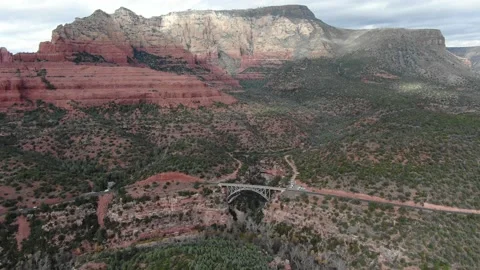 Aestetic bridge with red rock as background Stock Footage 141754538