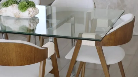 Aesthetic kitchen interior with clean glassy table decorated with contemporary Stock Footage 280494096