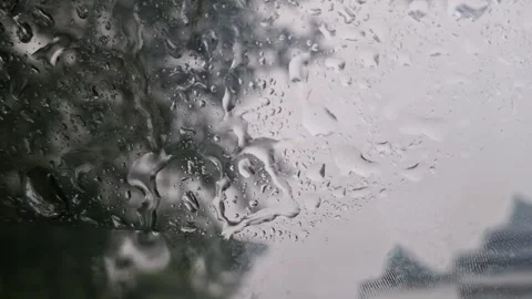 Aesthetic raindrops slowly streaming down on the car glass Stock Footage 287300294