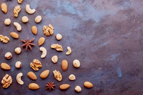 Aesthetic repeated pattern with assorted nuts on rustic background. Hazelnuts Stock Photos