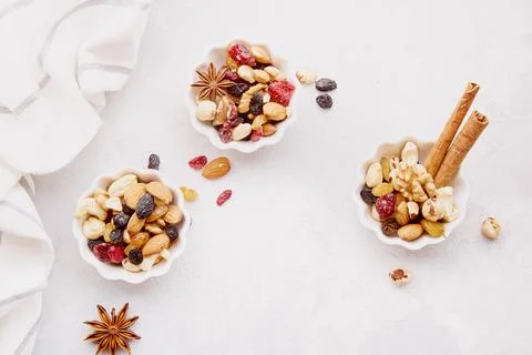 Aesthetic saucers of assorted nuts. Walnuts, almonds, hazelnuts and cashews Stock Photos