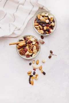 Aesthetic saucers with different nuts top view. Walnuts, almonds, hazelnuts and Stock Photos