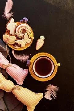 Aesthetic tea cup and Easter cookies with decorations, crafting bunny toys top Stock Photos