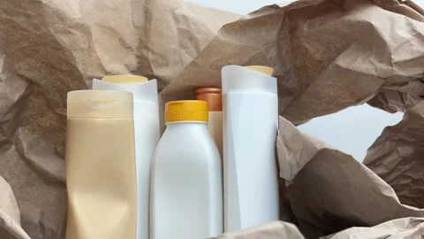 Aesthetic vertical b-roll with zoom out of sorted cosmetic packaging Video stock 336966849