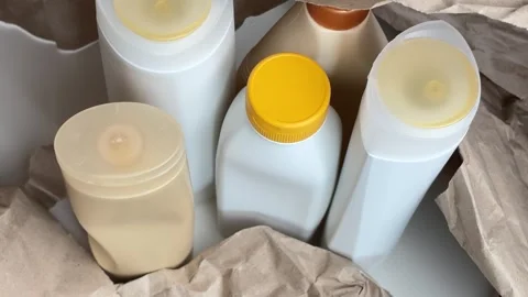 Aesthetic vertical b-roll with zoom out of sorted cosmetic packaging Stock Footage 336966992