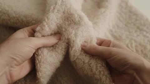 Aesthetic video of hands touching soft ivory wool fluffy sweater. Stock Footage 325345390