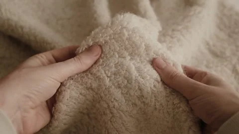 Aesthetic video of hands touching soft ivory wool fluffy sweater. Stock Footage 325345423