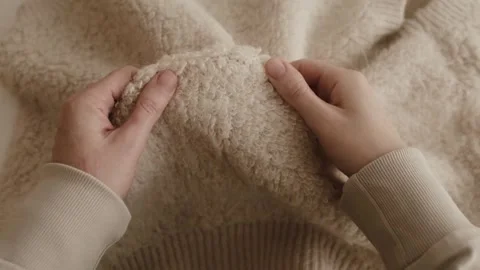 Aesthetic video of hands touching soft ivory wool fluffy sweater. Stock Footage 325345461