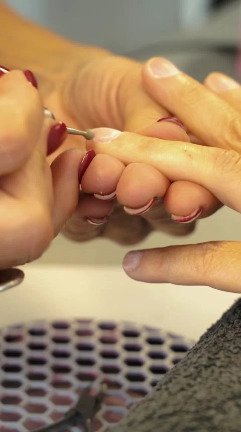 Aesthetician doing manicure in a nail center Stock Footage 252135597