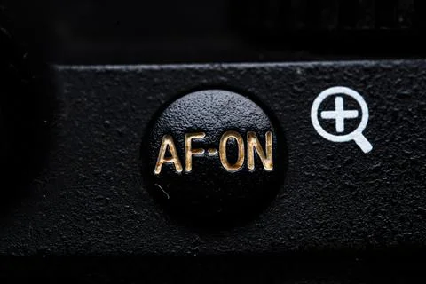 The AF - ON button is close on the camera. Old and dirty Stock Photos