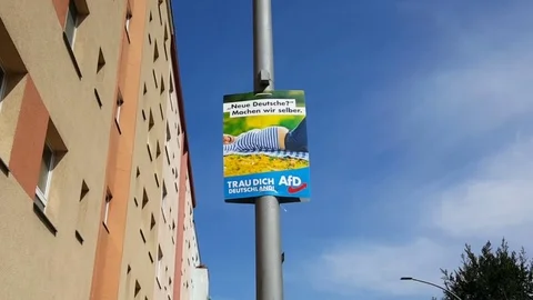 AFD German right wing party xenophobic campaign poster on pole, 2017, building 스톡 동영상 79148152