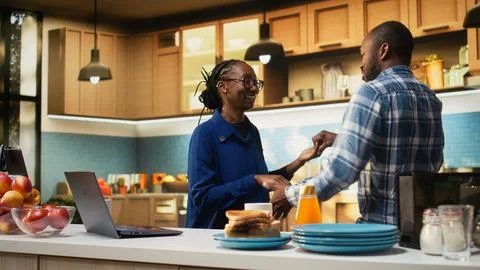 Affectionate black couple sharing a cute waltz in the kitchen Fotos Stock