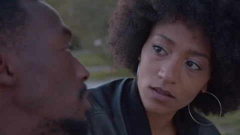 Affectionate black couple talking intimately outdoors Stock Footage 339852575