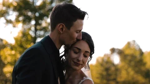 Affectionate Bride and Groom Content in Each Other's Love Stock Footage 142169900