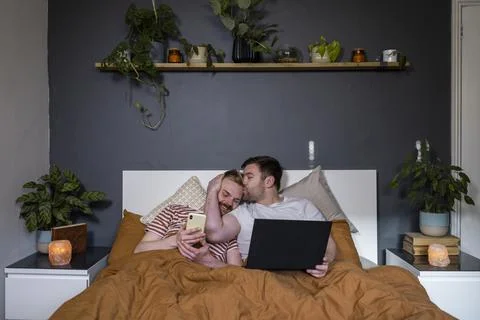 Affectionate Couple in Bed Fotos Stock