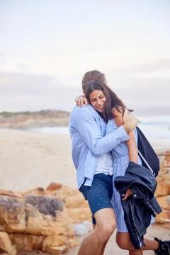 Affectionate couple hugging at beach Stock Photos