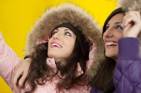 Affectionate friends on yellow background Stock Photos