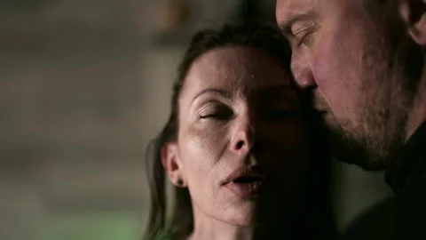 Affectionate hugging and touching of a man to a woman face create an atmosphere Stock Footage 269500636