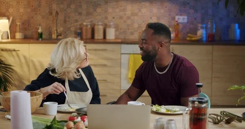 Affectionate mixed race couple spending nice time together at home kitchen Stock Footage 123668904