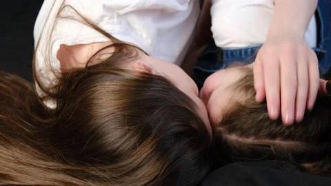 Affectionate mom having fun with cute small kid enjoy cuddling Vidéo 151341206