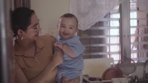 Affectionate mother holding her smiling son Vidéo 341892034