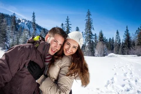 Affectionate winter couple Stock Photos