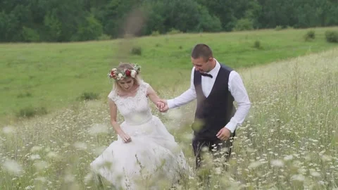 Affectionate Young Couple Slow Dance in a Field Together Stock Footage 234931185