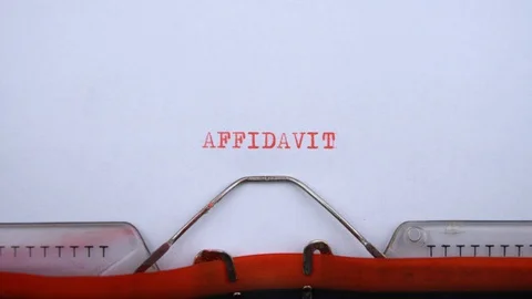 Affidavit - word printed on an old typewriter in red letters, close up. Video stock 128400872