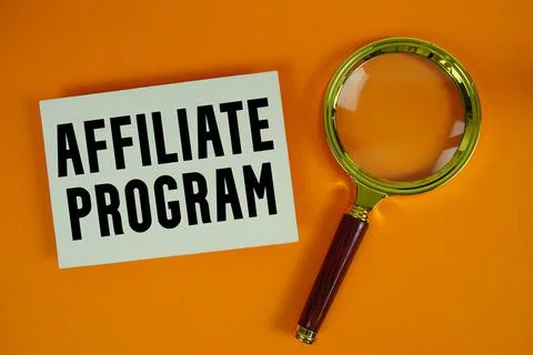 Affiliate Program text written on paper with magnifying glass Stock Photos