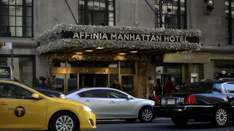Affinia Manhattan Hotel with cars driving out front, taxi cab pulling up, NYC Stock-Footage 59090269