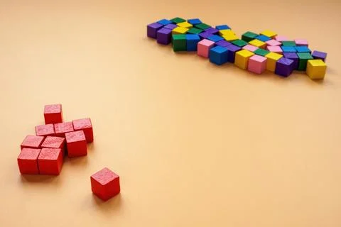 Affinity bias concept. Red cubes lie separately from other colors. Stock Photos
