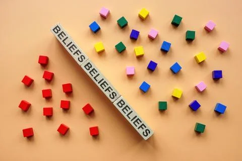Affinity bias concept. Wall from blocks with sign beliefs and cubes. Stock Photos