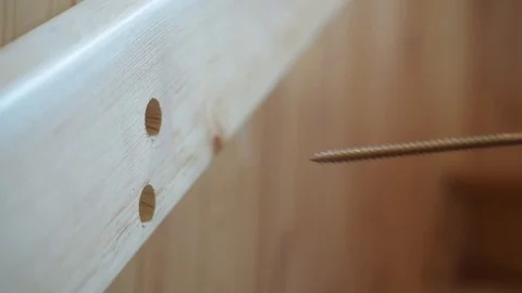 Affixing a handrail with a screw Stock Footage 87850000