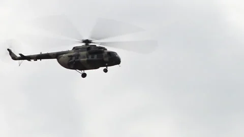 Afghan Air Force Mi-17 military transport helicopter flying overcast Video stock 213894103
