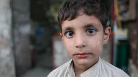 Afghan child looking at camera Stock Footage 37758169