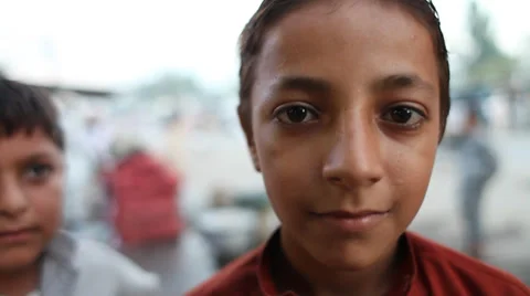 Afghan child looking at camera Stock Footage 37764450