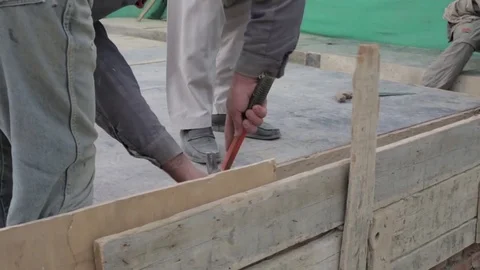 Afghan construction worker using hammer and nails Stock Footage 91969978