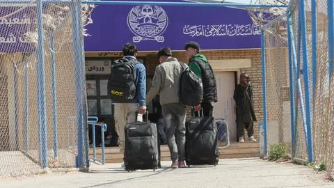 Afghans return from Iran through the Islam Qala border in Herat, Afghanistan - 1 Stock Photos