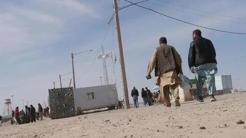 Afghans return from Iran through the Islam Qala border in Herat, Afghanistan - 1 Stock Photos