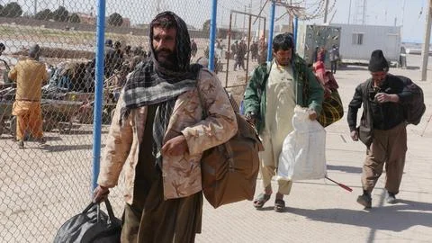 Afghans return from Iran through the Islam Qala border in Herat, Afghanistan - 1 Stock Photos