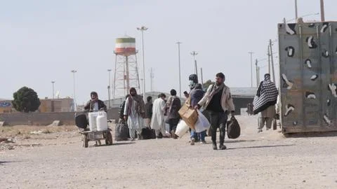 Afghans return from Iran through the Islam Qala border in Herat, Afghanistan - 1 Stock Photos