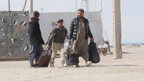 Afghans return from Iran through the Islam Qala border in Herat, Afghanistan - 1 Stock Photos