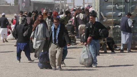 Afghans return from Iran through the Islam Qala border in Herat, Afghanistan - 1 Stock Photos